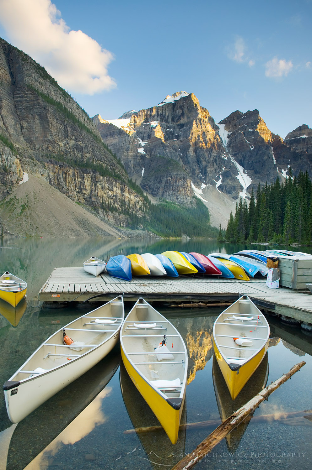 Colorful canoes on dock of Moraine Lake, Banff National Park Alberta Canada #45923