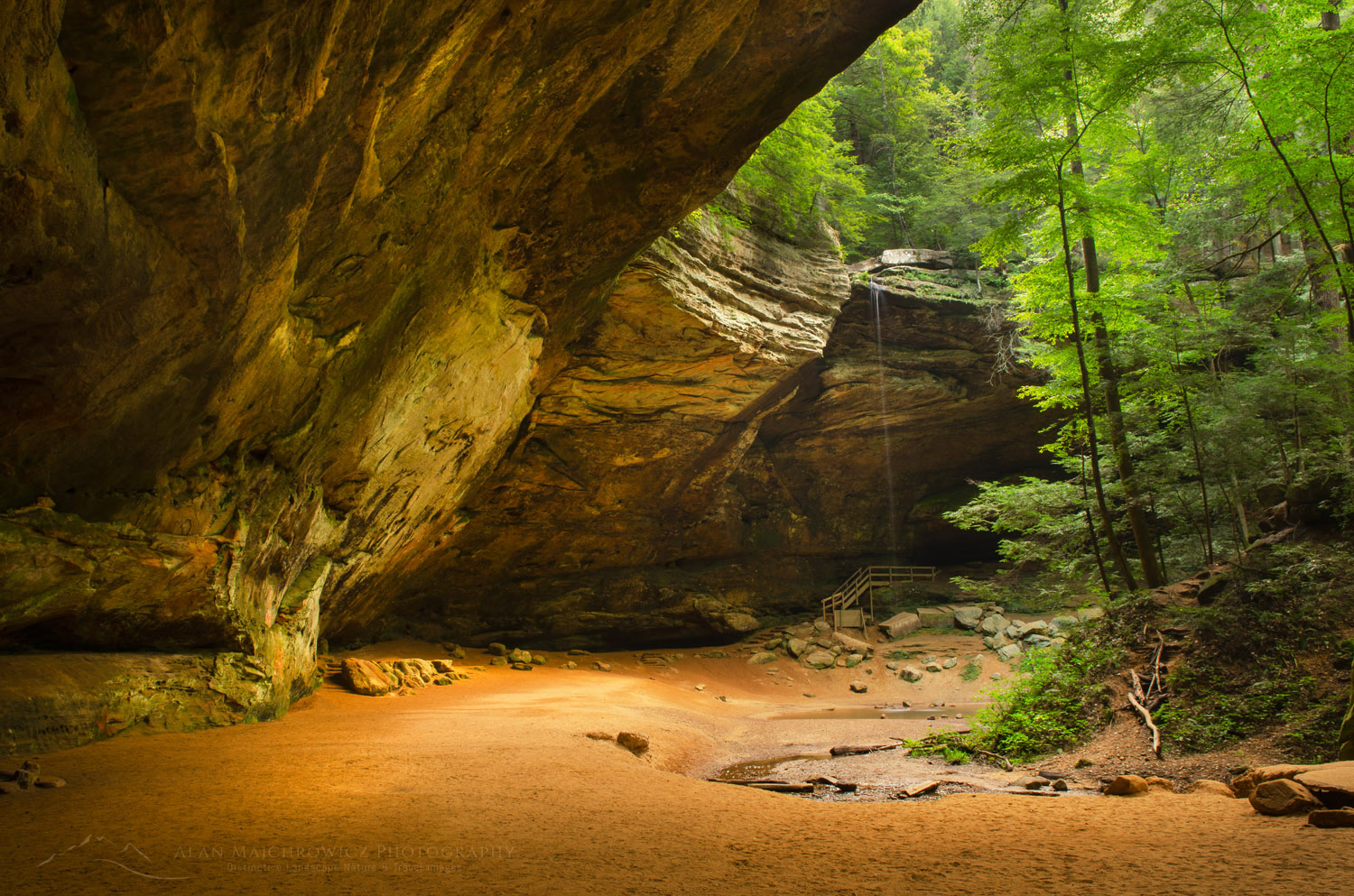 Ash Cave, formed from Blackhand Sandstone it is the large recessed cave in the state. Named after the huge pile of ashes found under the shelter by early settlers. Hocking Hills State Park Ohio #63274