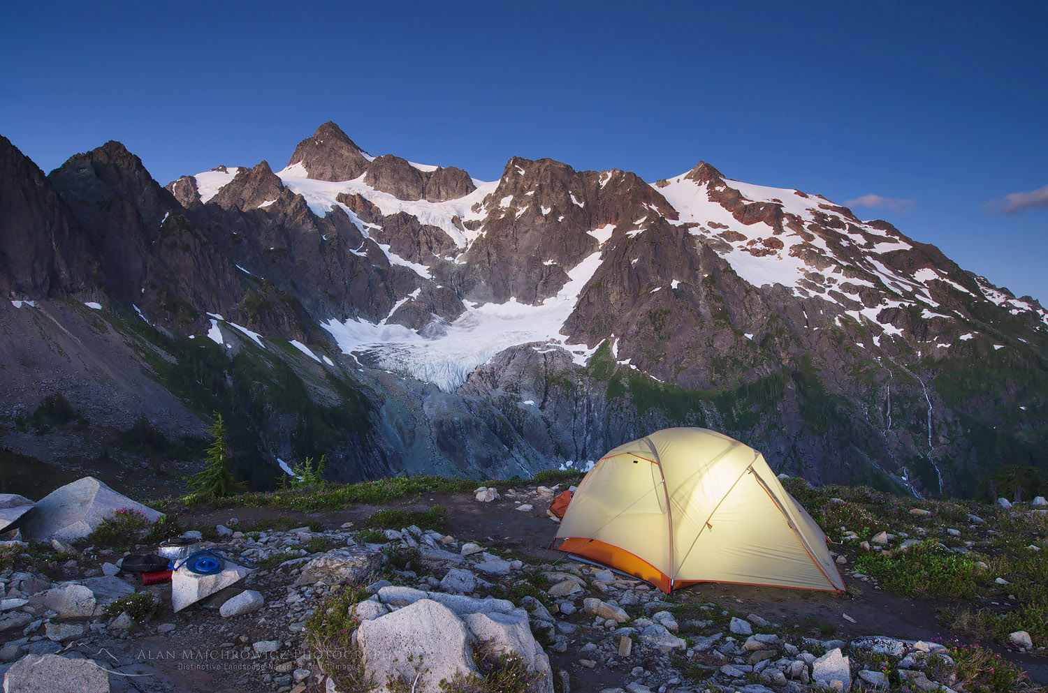 Tent illuminated at backcountry camp on ridge above Lake Ann, Mount Shuksan in the background, Mount Baker Wilderness North Cascades Washington #58125