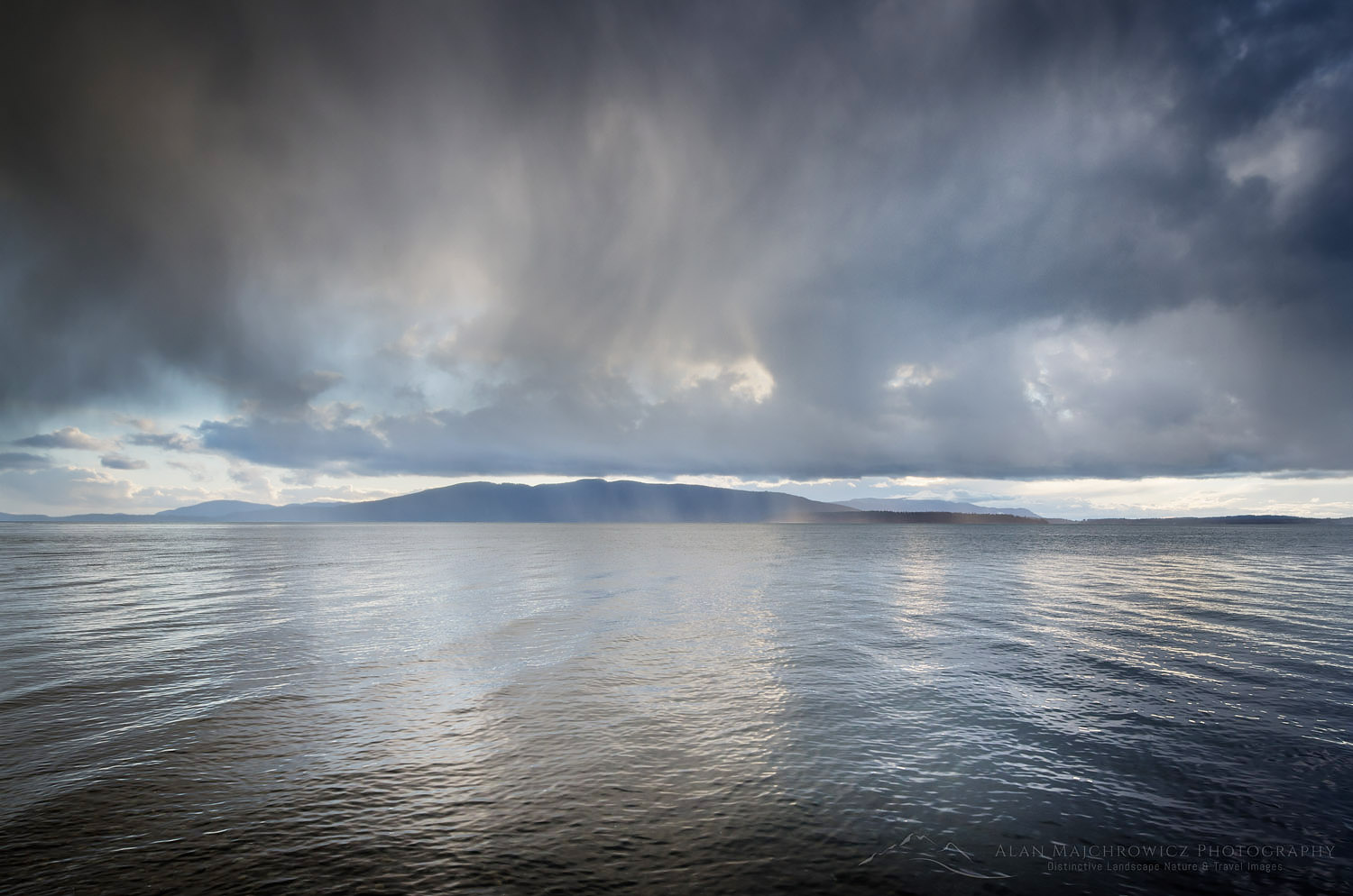 Stormy winter clouds over Bellingham Bay Washington. Lummi Island in the distance. #59689