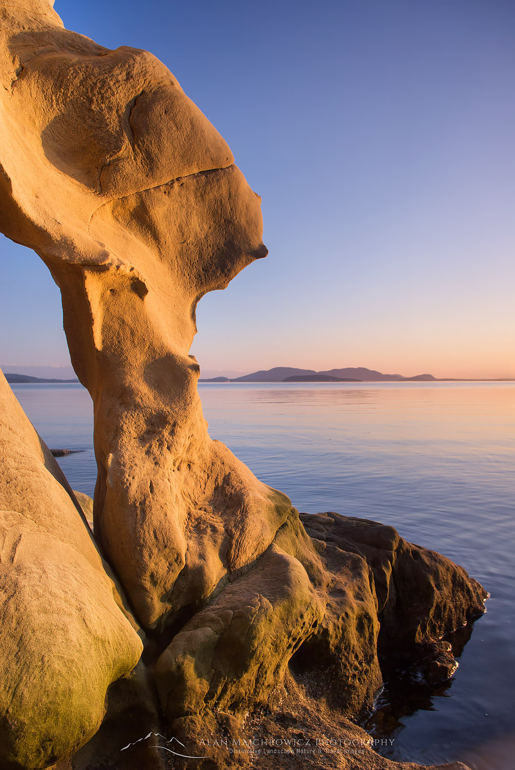Evening light on sandstone formations of Larrabee State Park Washington. In the distance are the San Juan Islands #16224