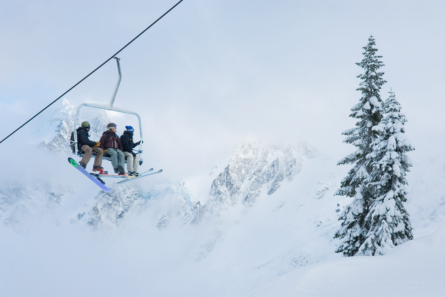 Skiers and snowboarders riding the lifts at Mount Baker Ski Area in the North Cascades Washington #53513