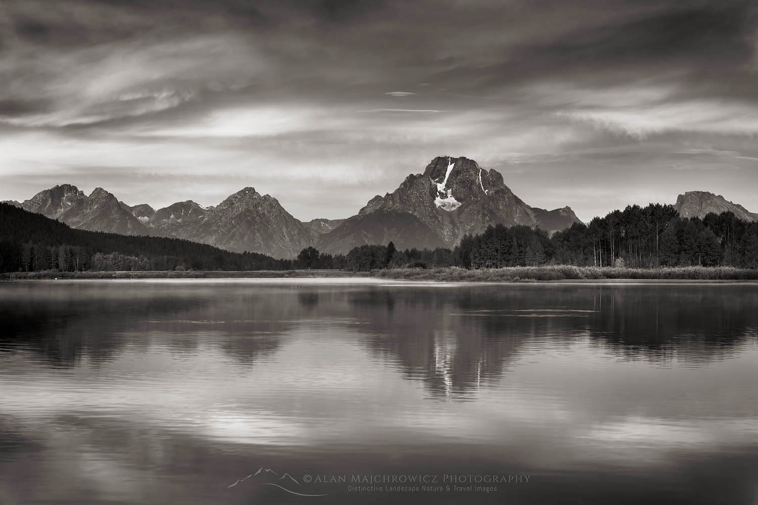 Mount Moran reflected in still waters of the Snake River at Oxbow Bend at sunrise, Grand Teton National Park Wyoming #67700bw