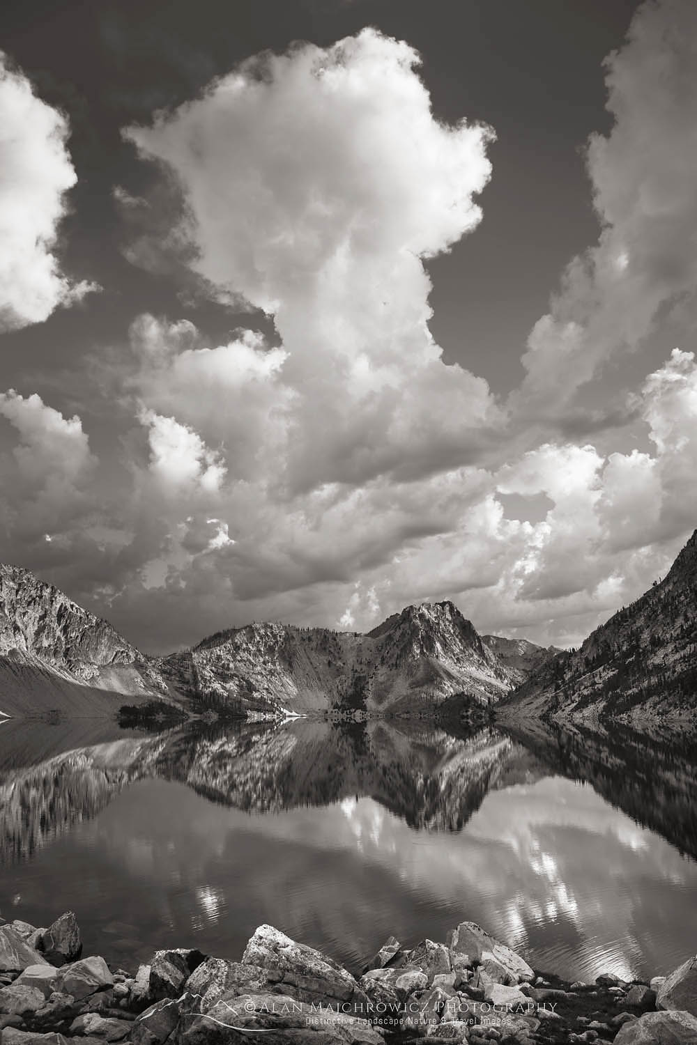 Morning clouds mirrored in still waters of Sawtooth Lake. Sawtooth Mountains Wilderness Idaho #65974bw