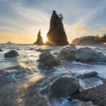 Setting sun behind Split Rock on Rialto Beach, Olympic National Park