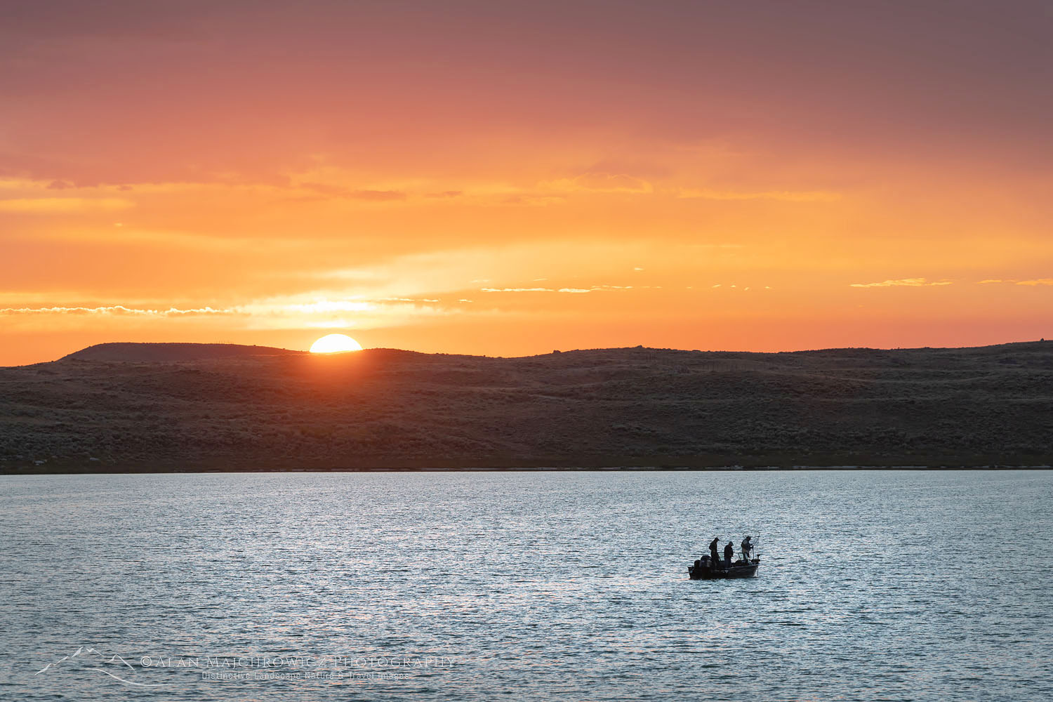 Fishing from boat on Soda Lake at sunset, Wyoming #69018