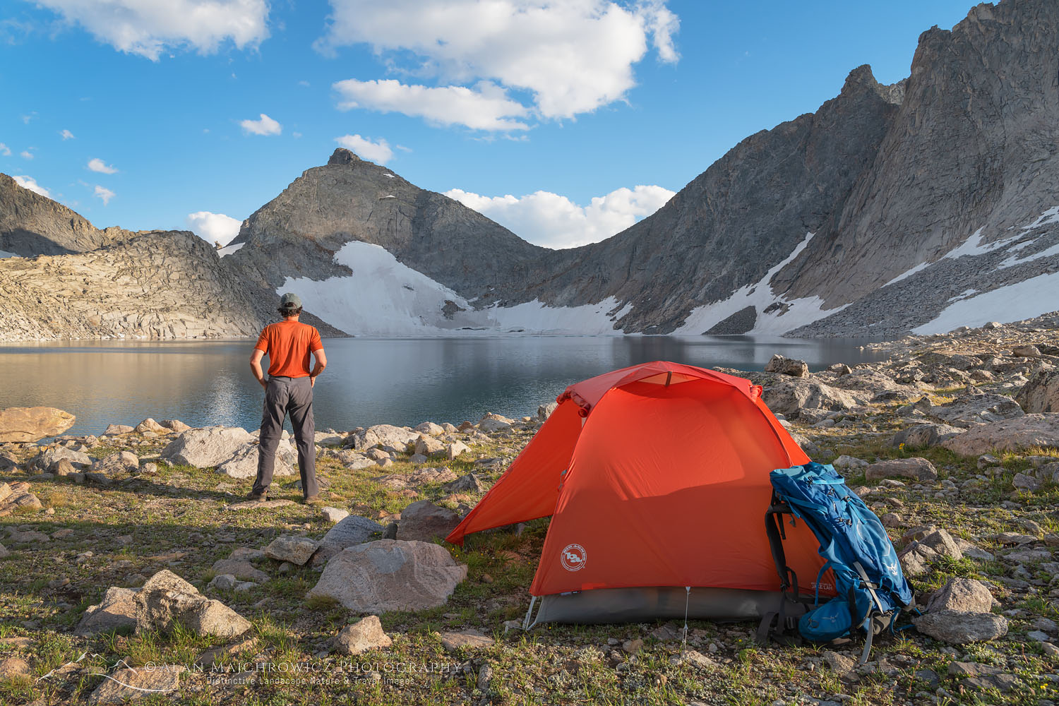 Noel Lake backcountry camp with adult male backpacker in red shirt enjoying the view. Bridger Wilderness. Wind River Range, Wyoming #69240