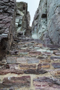 Stairs cut in rock at final segment to Comeau Pass trail Glacier National Park