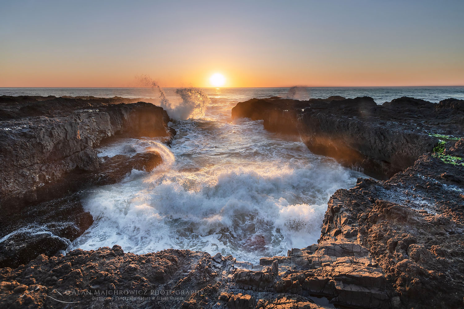 Waves crash though lava headlands during sunset at Cape Perpetua Oregon #71095