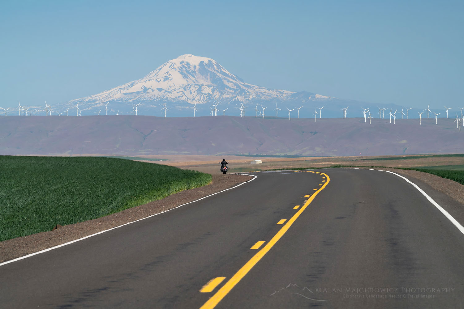 Motorcyclist on Oregon Highway 206 near Wasco Oregon. Mount Adams is in the distance #71639