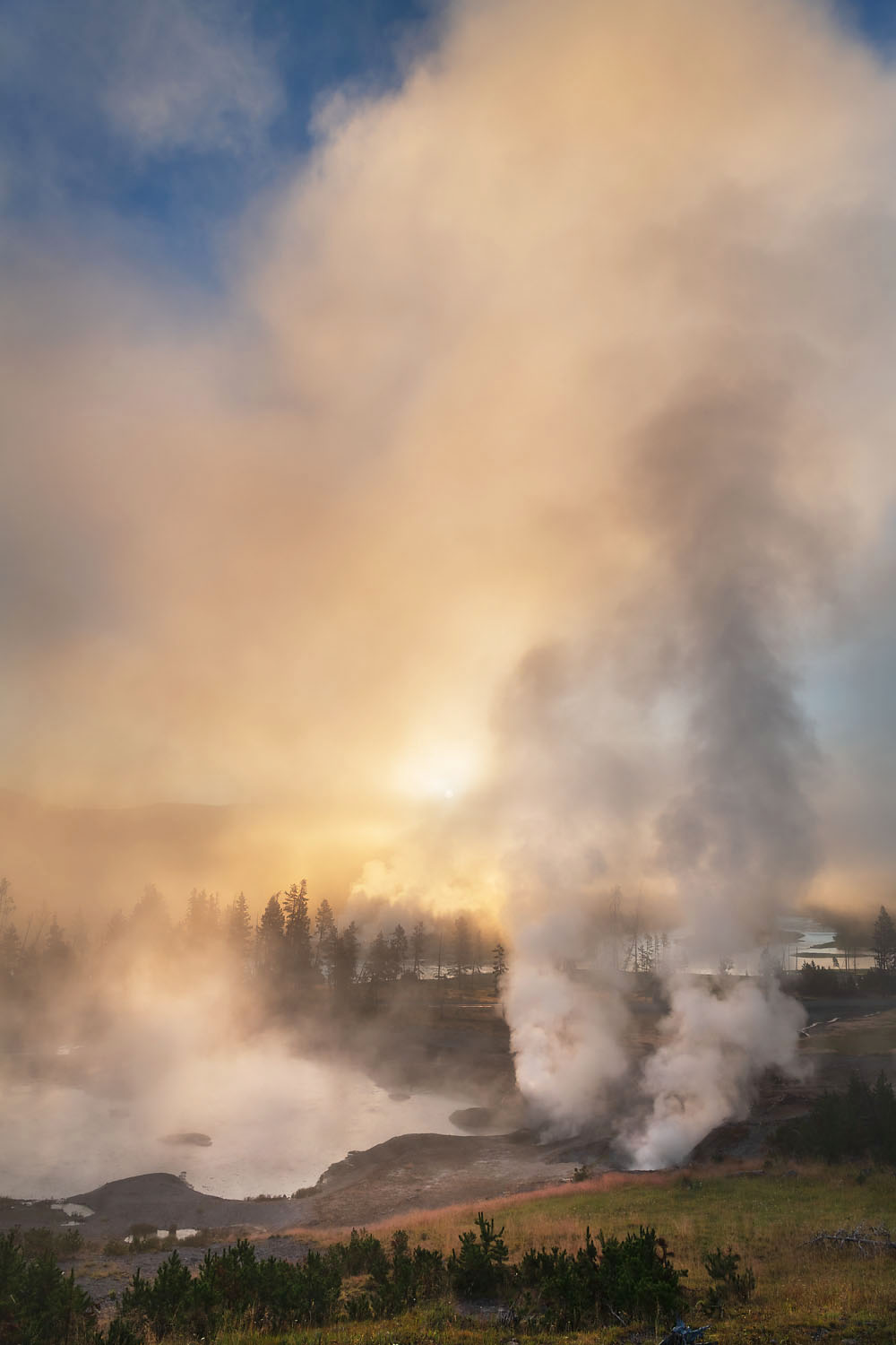 Fog and steam rising from Mud Volcano area geysers and hot springs at sunrise. Yellowstone National Park #69428