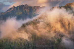 Misty clouds swirling around peaks of the North Cascades in Heather Meadows Recreation Area, Washington #73538b