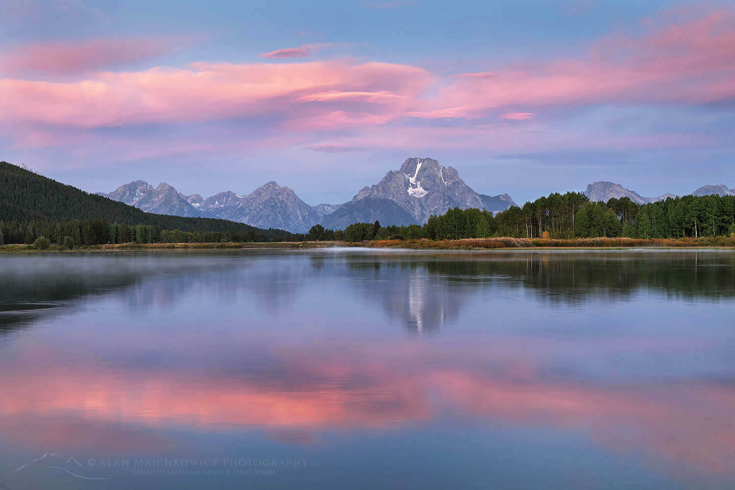 Pink and purple clouds and Mount Moran reflected in still waters of the Snake River at Oxbow Bend at sunrise, Grand Teton National Park Wyoming #67686
