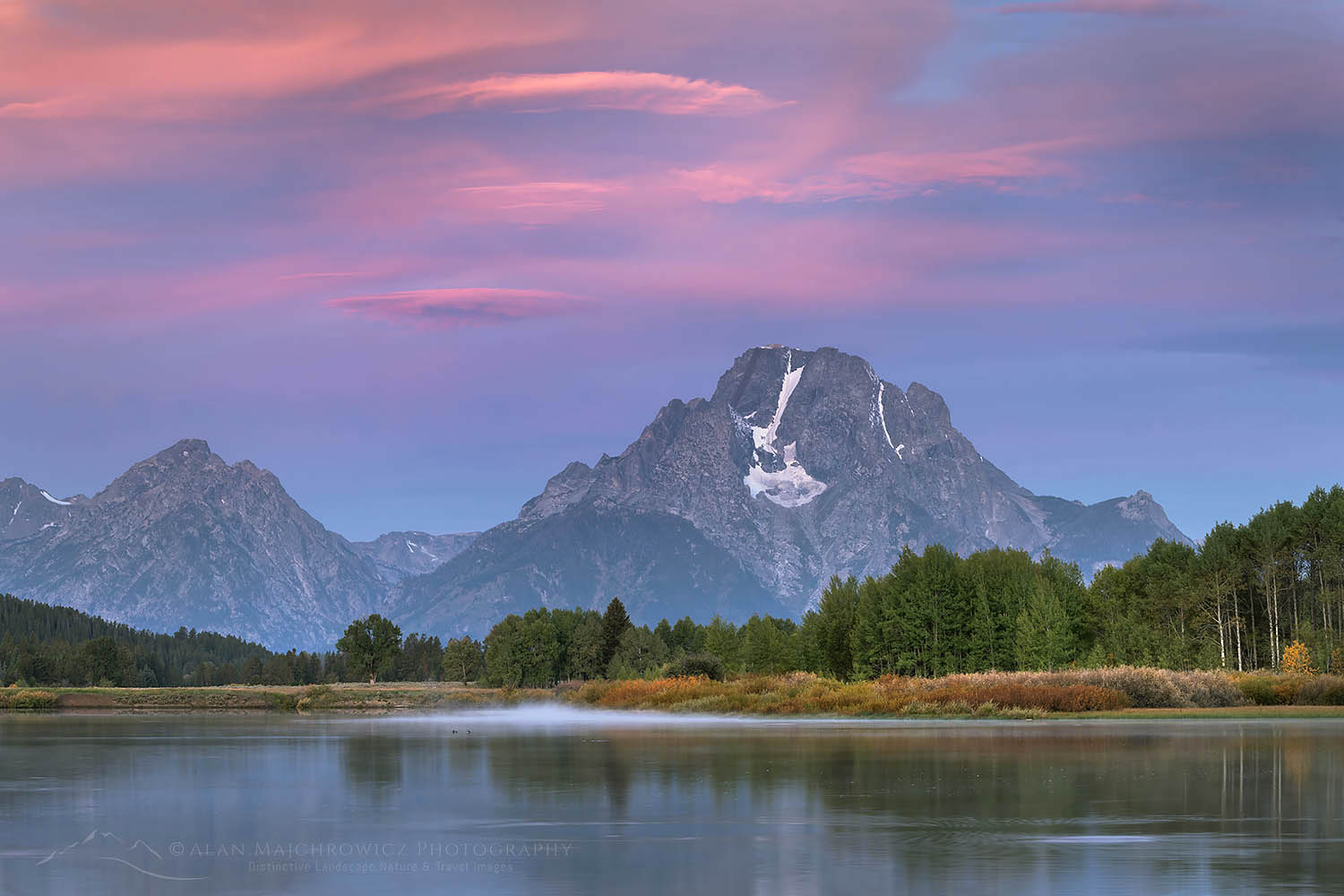 Pink and purple clouds and Mount Moran reflected in still waters of the Snake River at Oxbow Bend at sunrise, Grand Teton National Park Wyoming #67687
