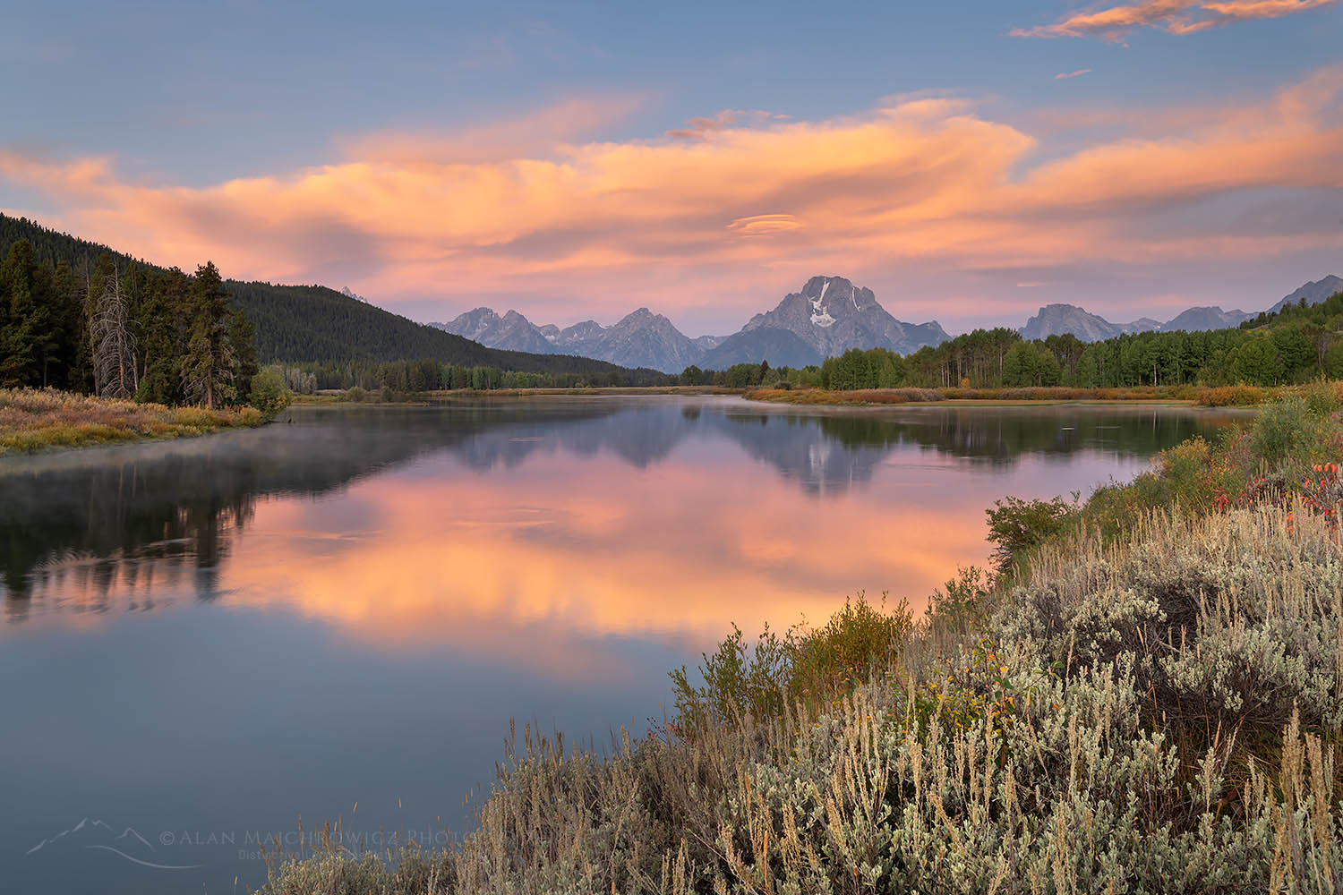 Orange clouds and Mount Moran reflected in still waters of the Snake River at Oxbow Bend at sunrise, Grand Teton National Park Wyoming #67693