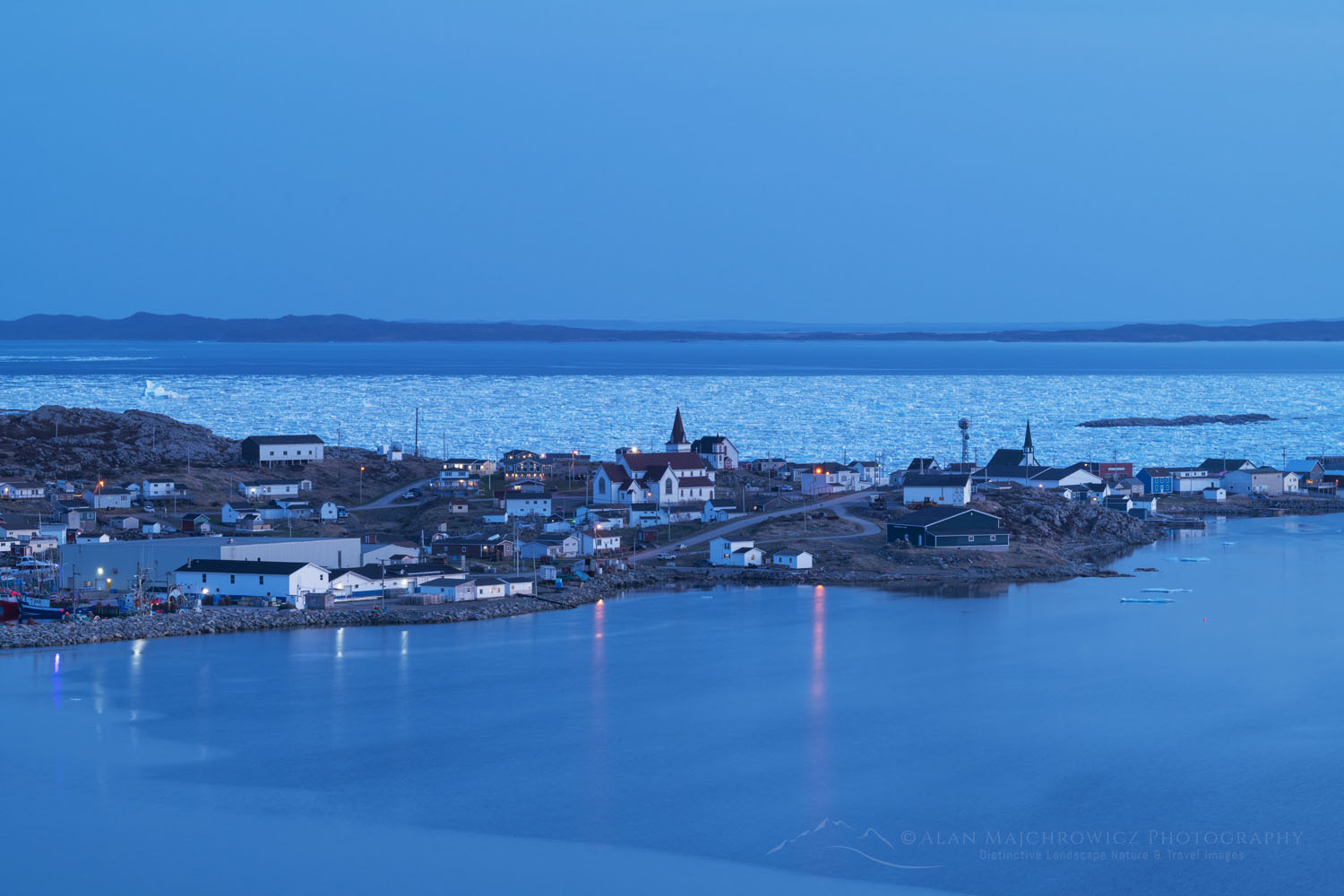 Town of Fogo, with sea ice in Seal Cove. Fogo Island Newfoundland and Labrador Canada #80195