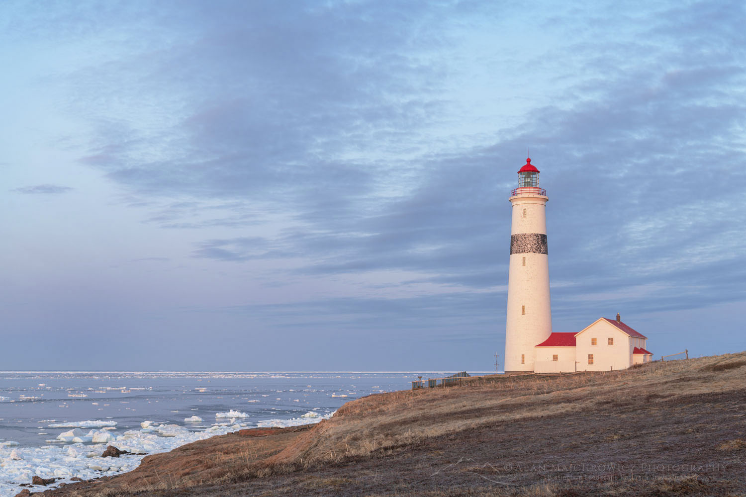 Point Amour Lighthouse glowing in sunrise light. Point Amour Lighthouse Provincial Historic Site on the south coast of Labrador, Newfoundland and Labrador Canada #80331