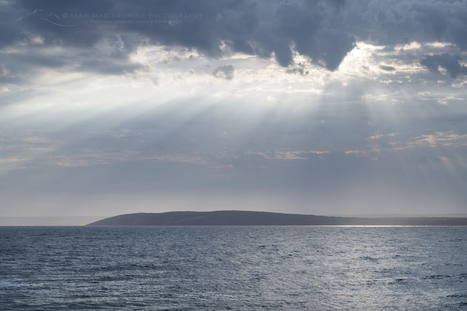 Suns rays shining through clouds at Portugal Cove, Avalon Peninsula. Newfoundland and Labrador Canada #80668