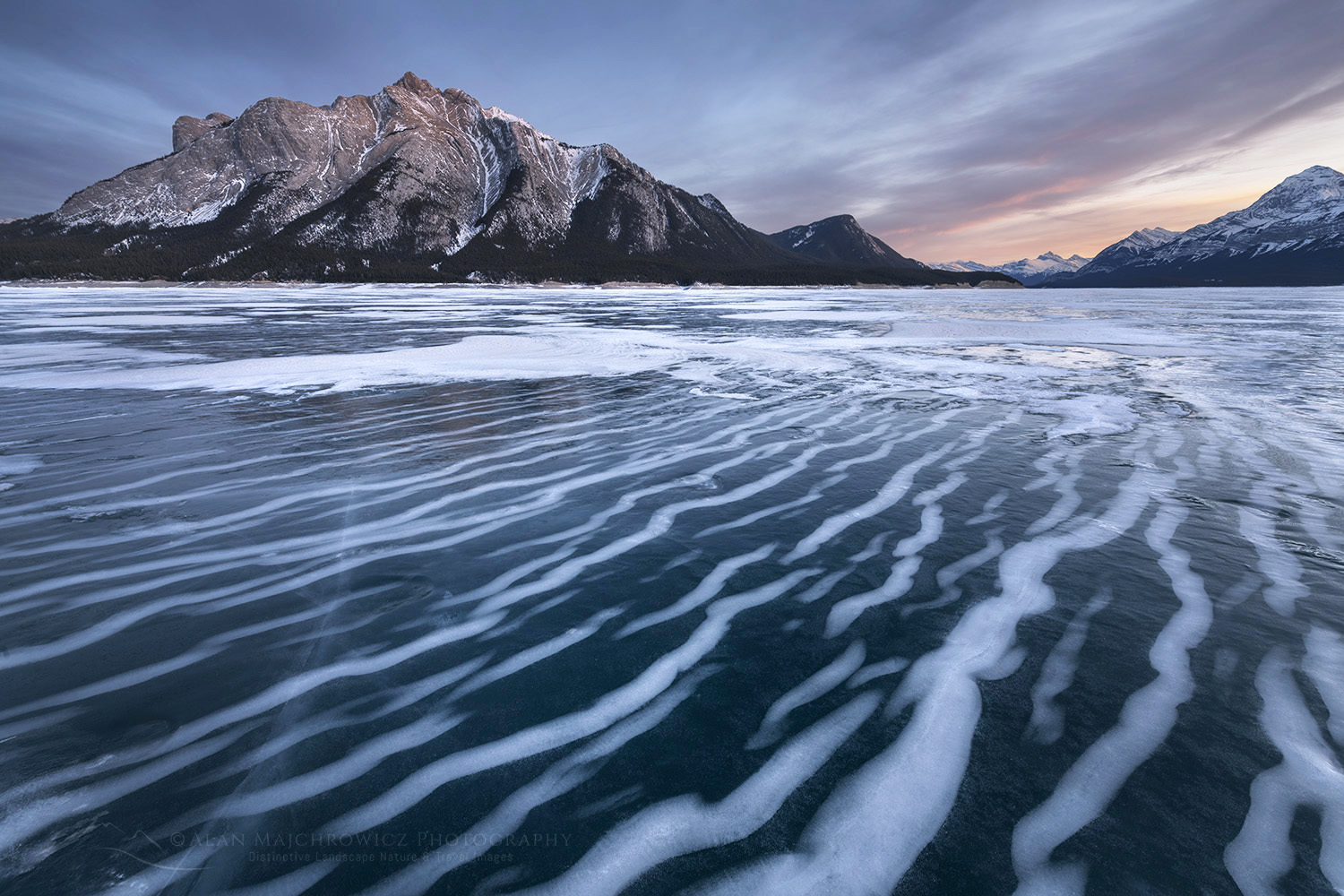 Striped patterns of snow frozen in the surface of Abraham Lake Alberta Canada #82406