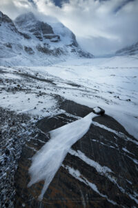 Windswept terminal moraine of Athabasca Glacier in winter, Mount Andromeda and Athabasca Glacier are in the distance. Jasper National Park Alberta Canada #82245b Photo Highlight 2024 Windswept terminal moraine of Athabasca Glacier in winter, Mount Andromeda and Athabasca Glacier are in the distance. Jasper National Park Alberta Canada #82245b Photo Highlight 2024