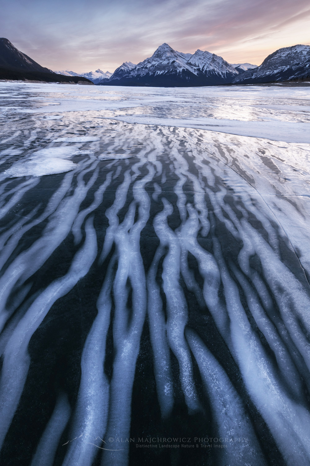 Striped patterns of snow frozen in the surface of Abraham Lake Alberta Canada #82384