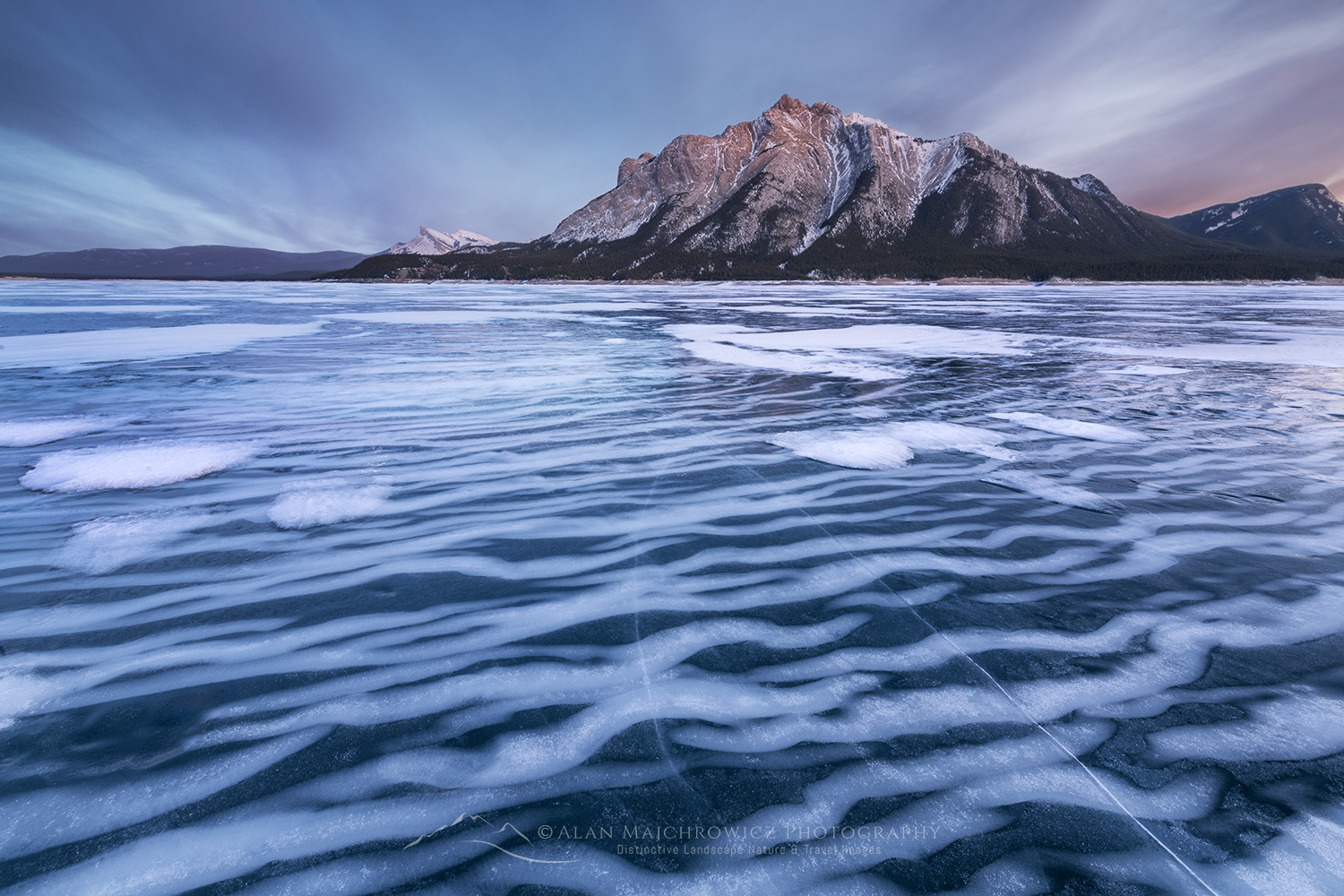 Striped patterns of snow frozen in the surface of Abraham Lake Alberta Canada #82390
