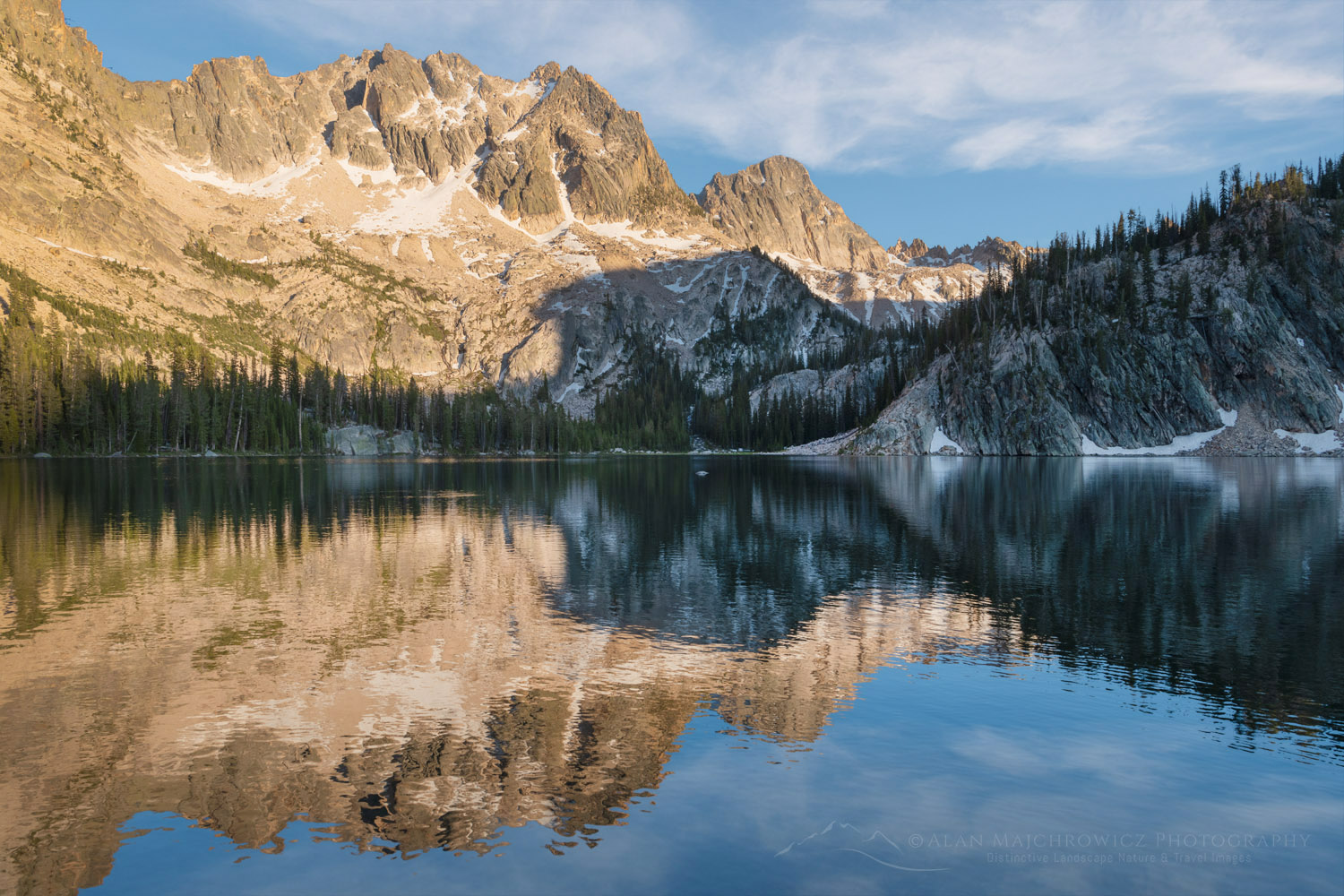 Sevy Peak and Mount Cramer are reflected in the still waters of Upper Cramer Lake. Sawtooth Wilderness, Idaho #83610