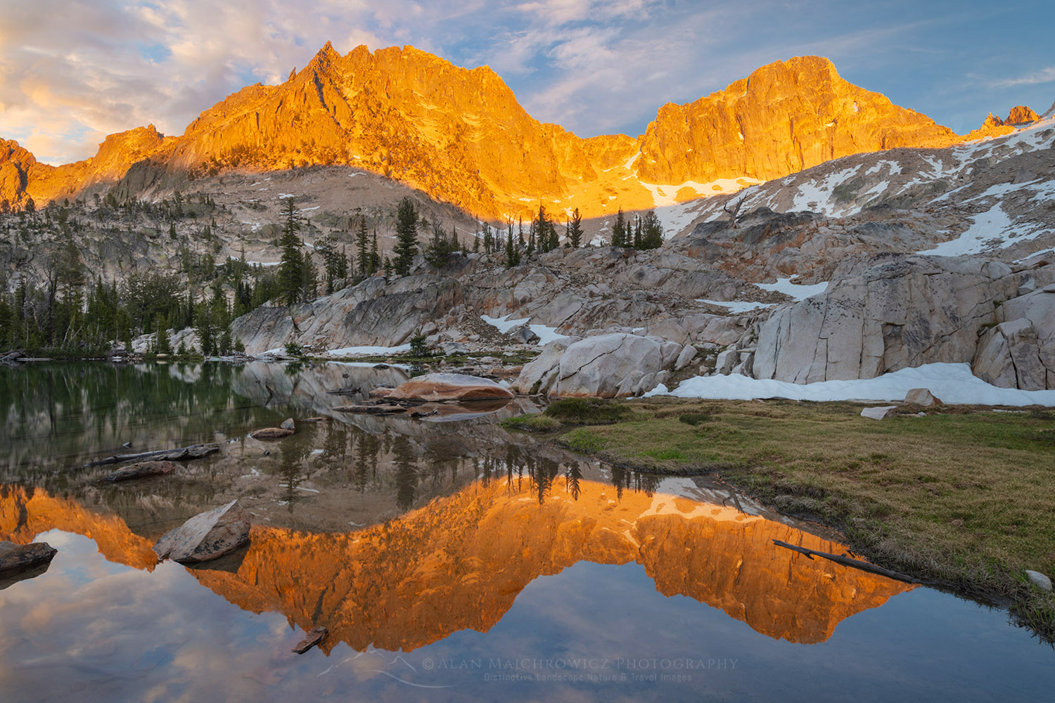 Golden light of sunset reflected on still waters of a tarn in Upper Cramer Basin Sawtooth Wilderness, Idaho #83712