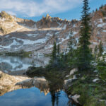 The Temple reflected in the still waters of a tarn in Cramer Basin. Sawtooth Wilderness, Idaho #83651