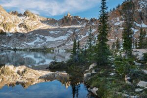 The Temple reflected in the still waters of a tarn in Cramer Basin. Sawtooth Wilderness, Idaho #83651