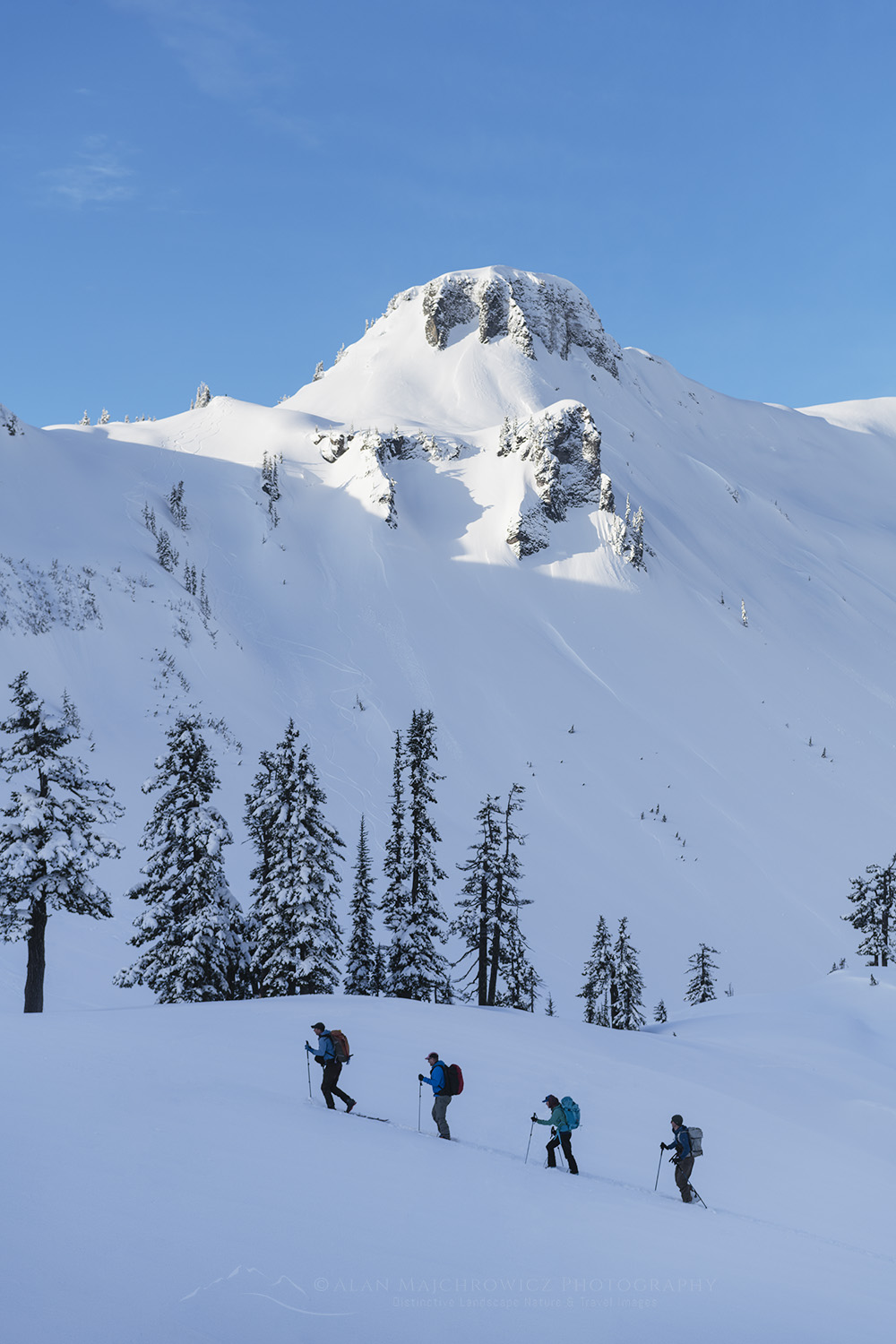 Backcountry skiers ascending slope. Heather Meadows Recreation Area, Mt. Baker-Snoqualmie National Forest, North Cascades Washington #77164