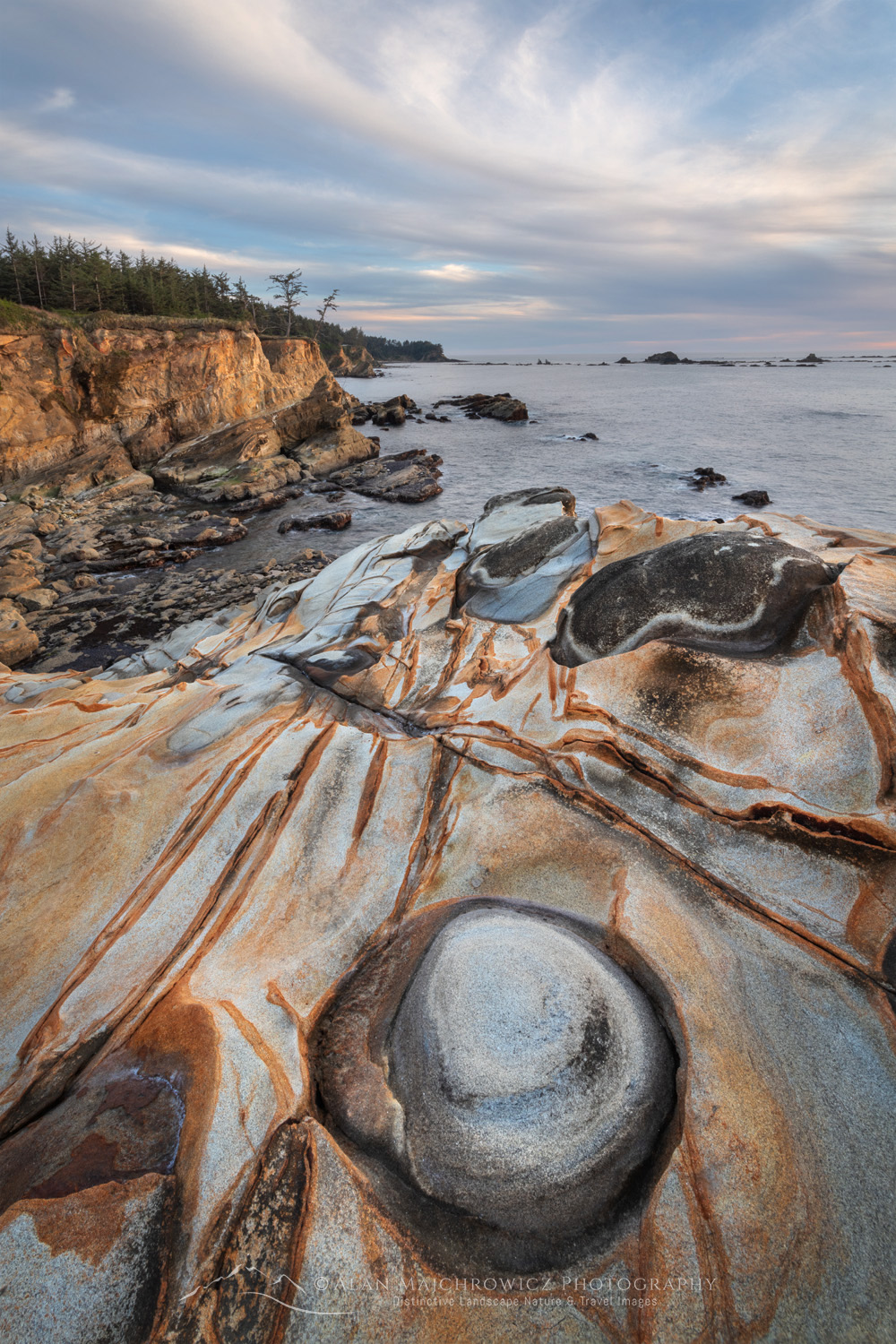 Sunset over Mineral concretions on cliffs of Shore Acres State Park Oregon #82984