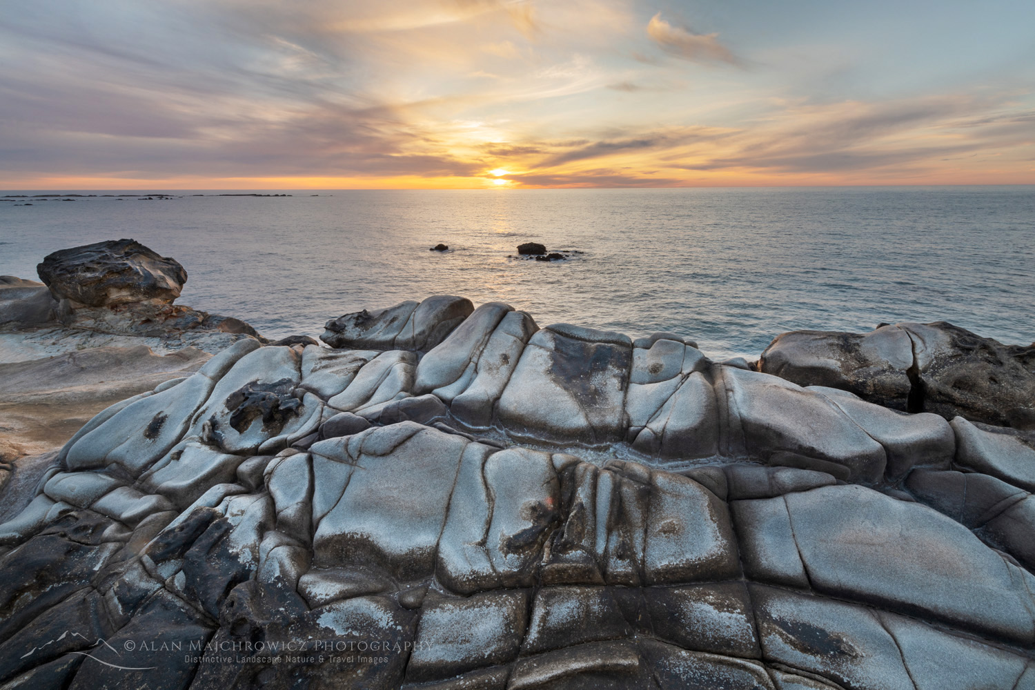 Sunset over Mineral concretions on cliffs of Shore Acres State Park Oregon #83005