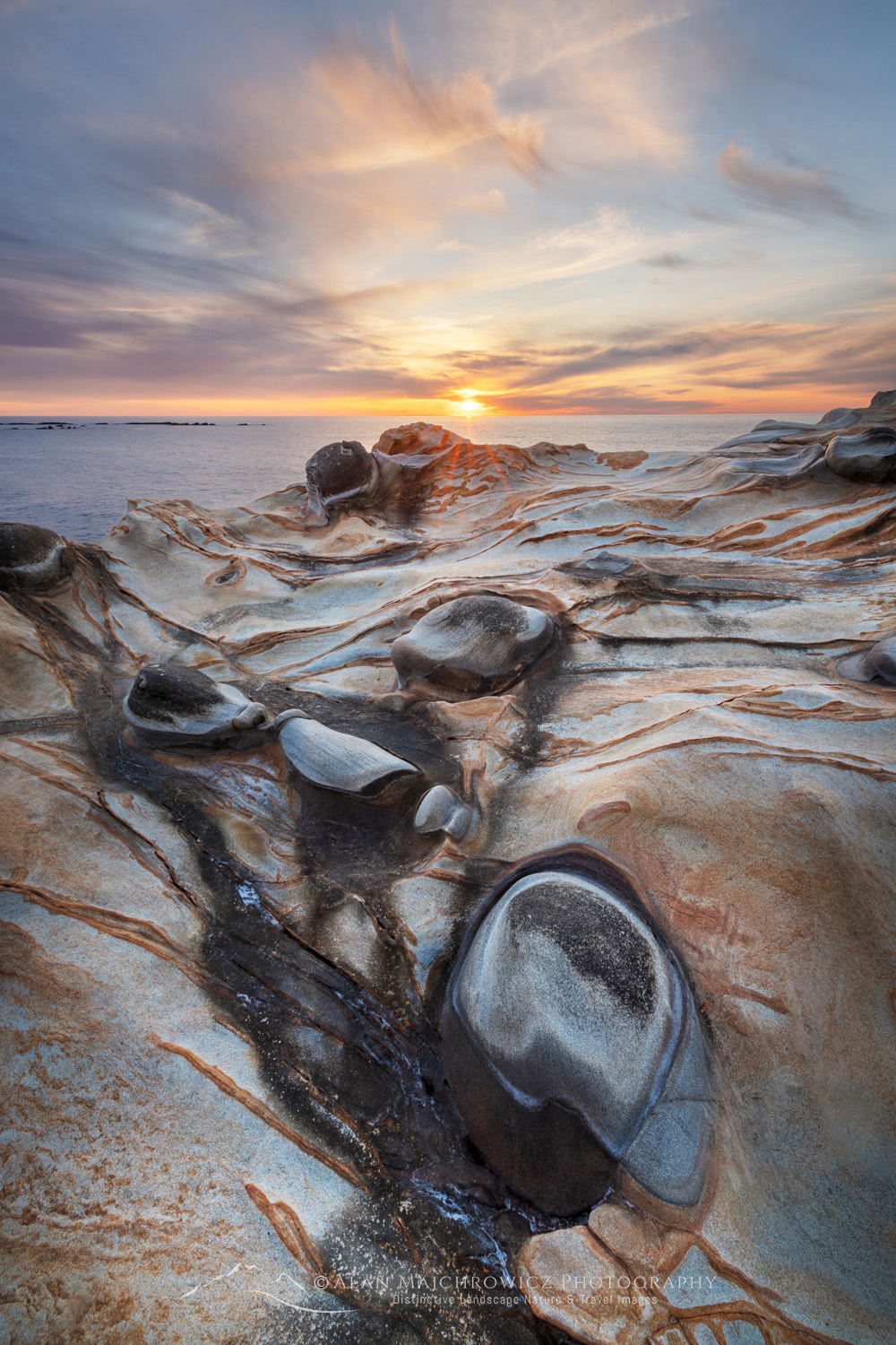 Sunset over Mineral concretions on cliffs of Shore Acres State Park Oregon #83012