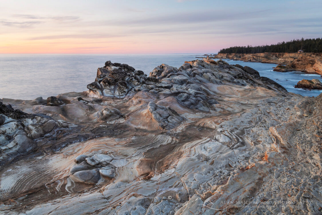 Twilight over Mineral concretions and and stone Striations on cliffs of Shore Acres State Park Oregon #83049