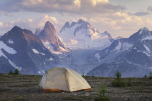 Tent at backcountry camp on Rocky Point Ridge. Howser Towers Vowell Glacier in the distance. Bugaboo Provincial Park, Purcell Mountains, British Columbia. #62962