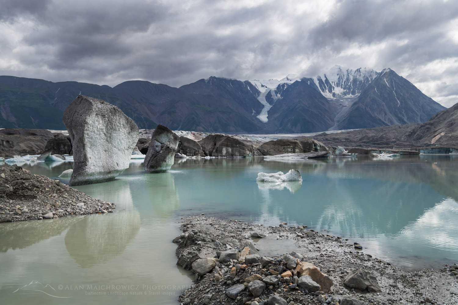 Icebergs stranded on debris at the ice-marginal lake of Kaskawulsh Glacier. Ä’äy Chù (Slim's River) West, Kluane National Park, Yukon #86720
