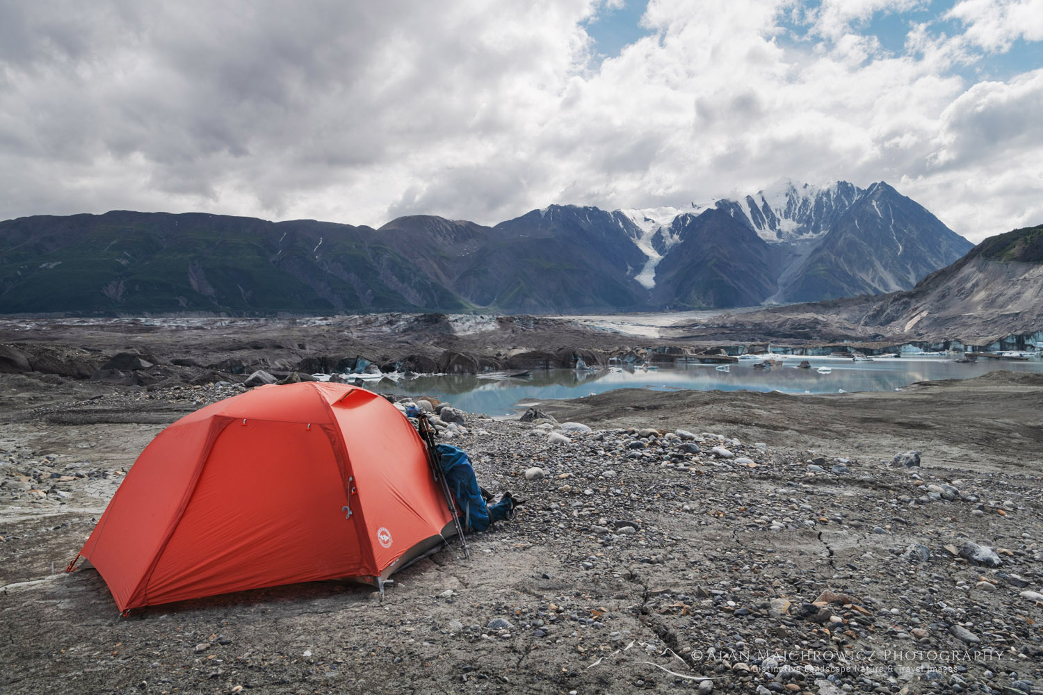 Red tent on the debris fields at the toe of the Kaskawulsh Glacier. Ä’äy Chù (Slim's River) West, Kluane National Park, Yukon #86719