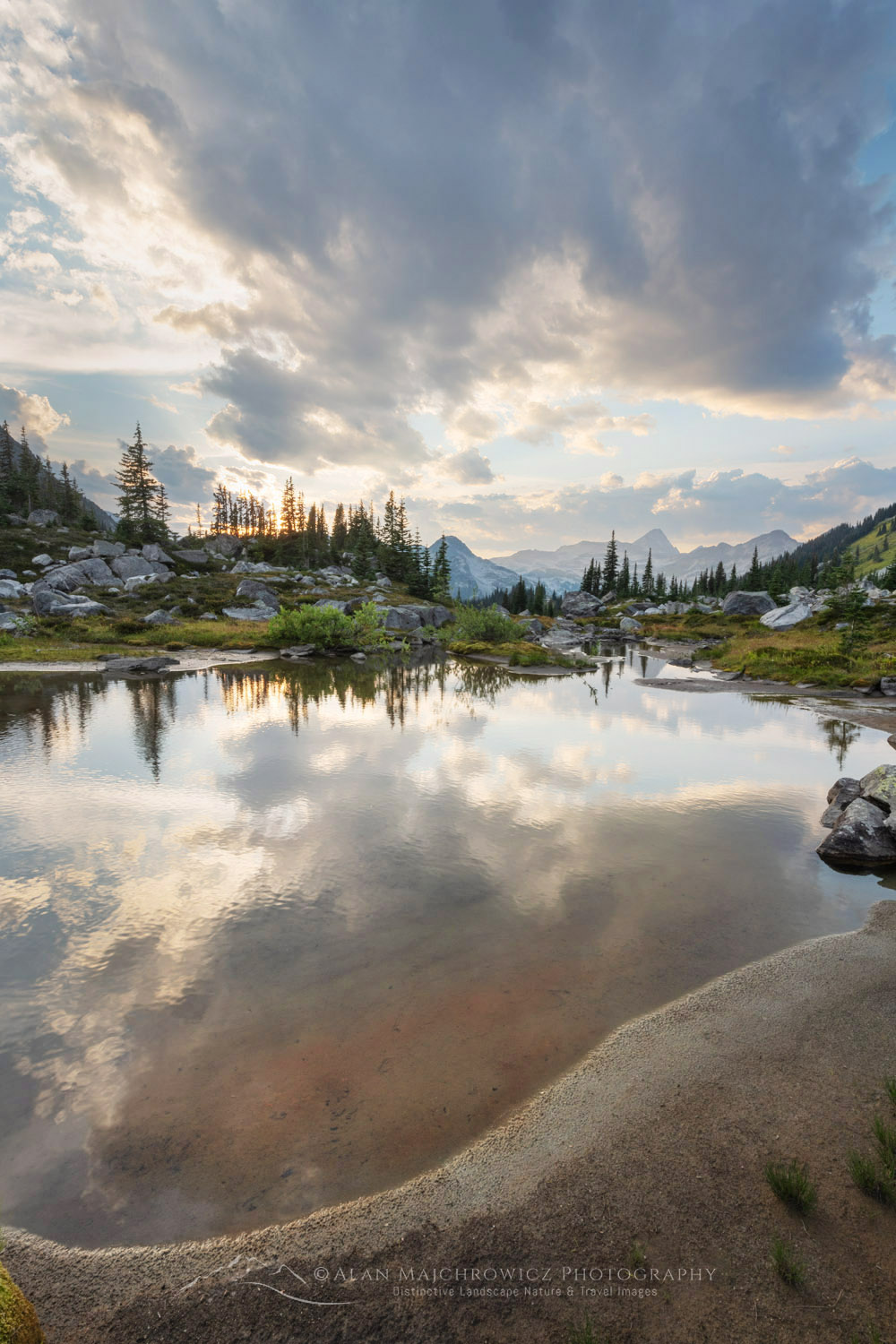 Dramatic clouds over alpine meadows below Mount Rohr. Coast Range, British Columbia