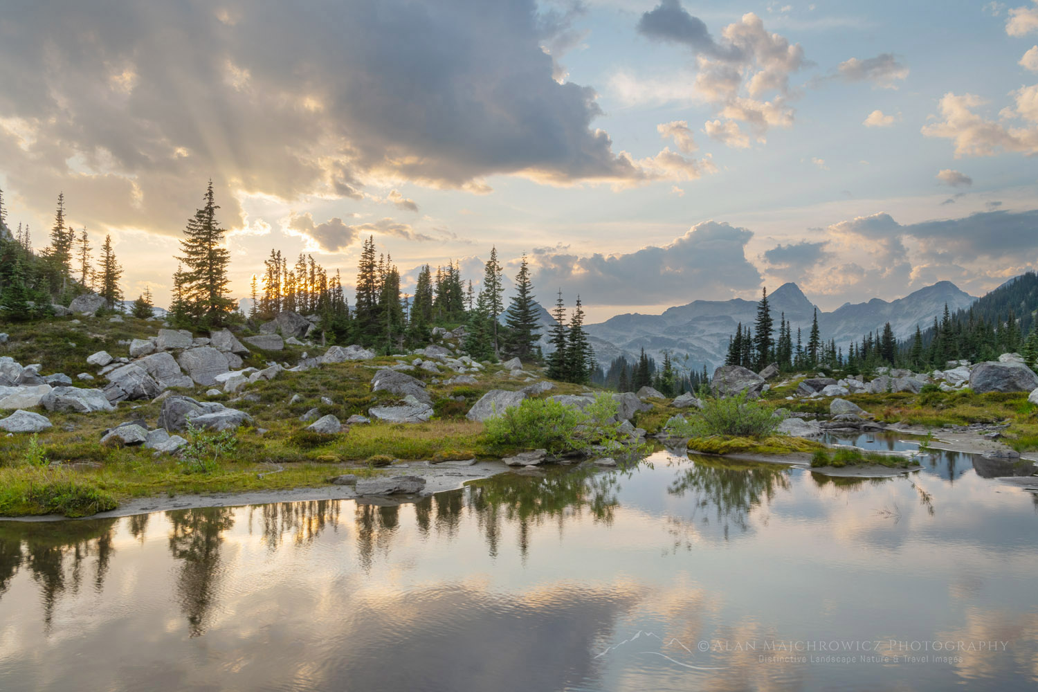 Dramatic clouds over alpine meadows below Mount Rohr. Coast Range, British Columbia