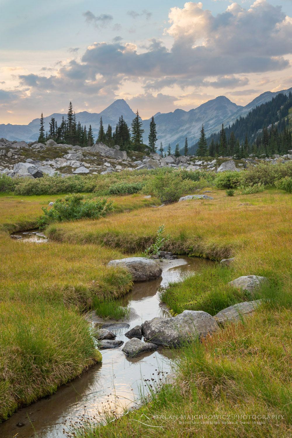 Evening clouds over an alpine basin of Mount Rohr. Coast Range, British Columbia