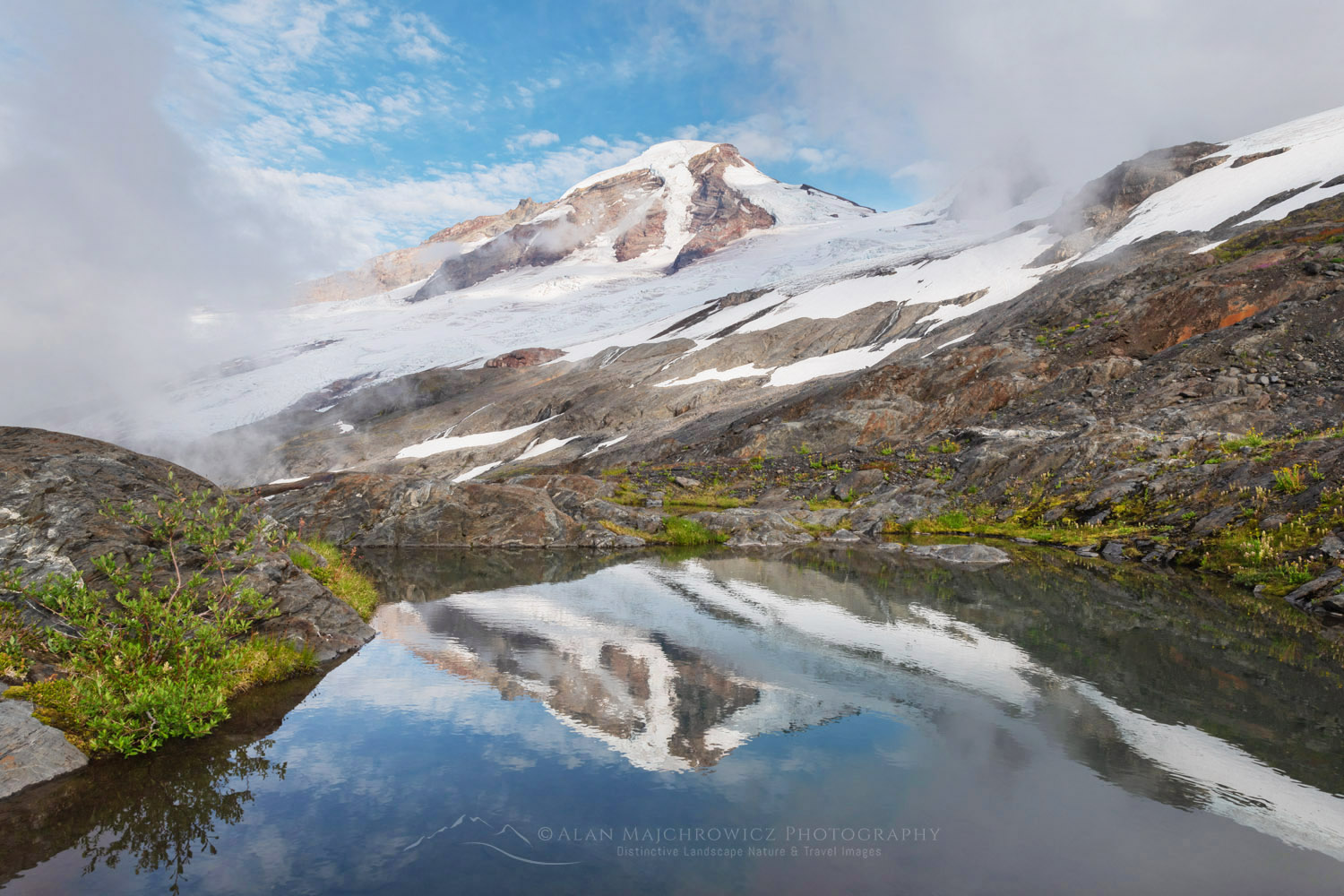 Mount Baker reflected in tarn on Heliotrope Ridge. Mount Baker Wilderness, North Cascades Washington