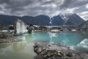 Icebergs are stranded on debris at the ice-marginal lake of Kaskawulsh Glacier. Ä’äy Chù (Slim's River) West, Kluane National Park, Yukon #86720