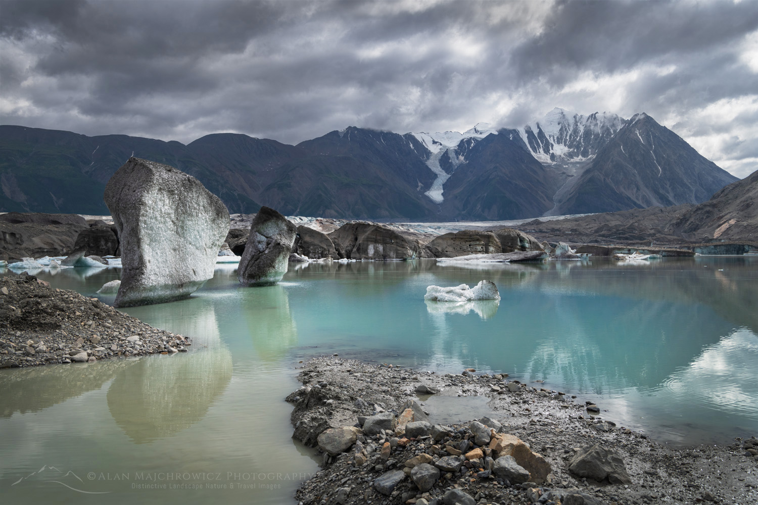 Icebergs are stranded on debris at the ice-marginal lake of Kaskawulsh Glacier. Ä’äy Chù (Slim's River) West, Kluane National Park, Yukon #86720