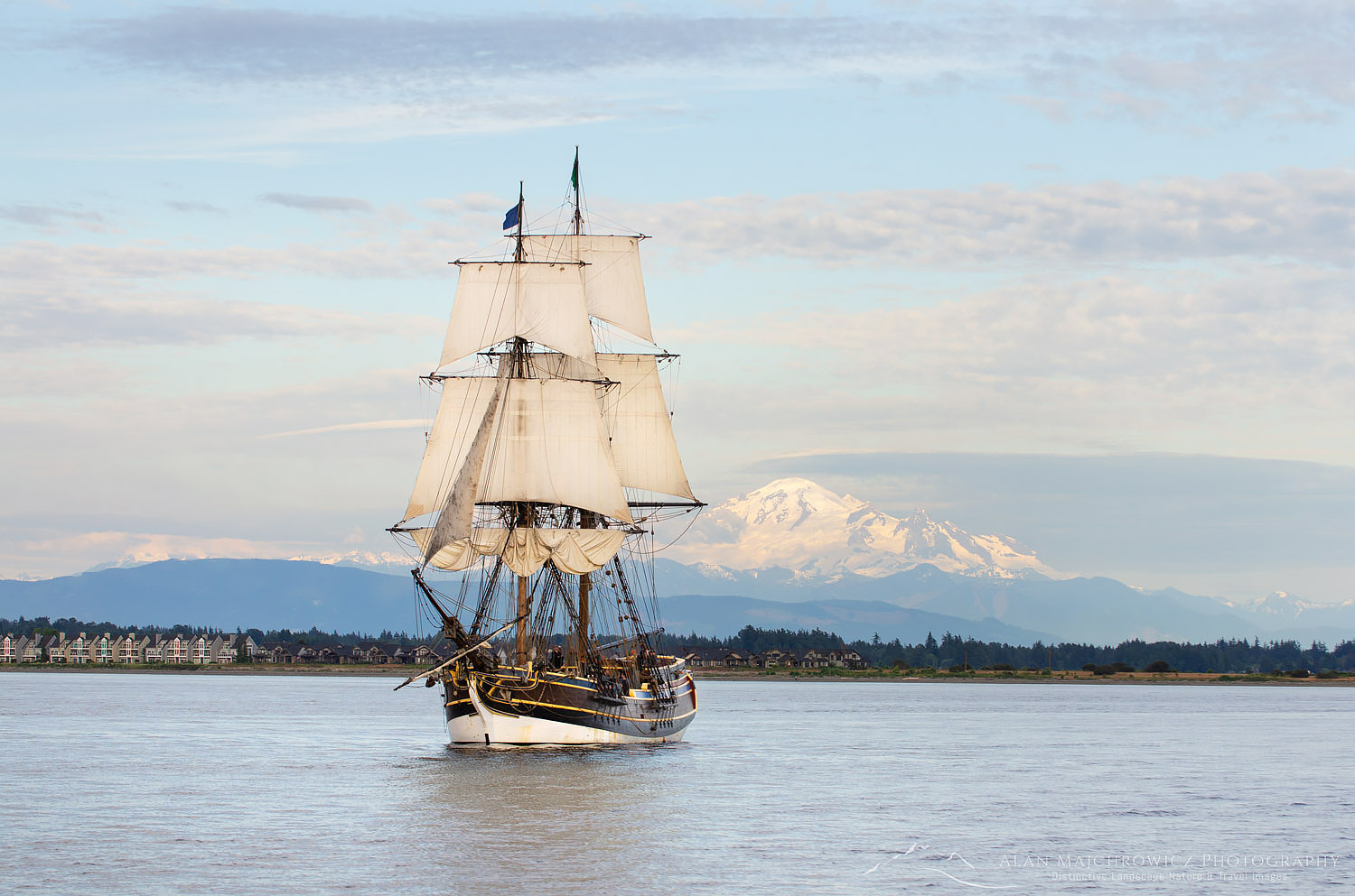 Lady Washington at sail in Semiahmoo Bay, Washington. Mount Baker is in the distance. A historic replica of the original 18th-century brig. Owned and operated by the Grays Harbor Historical Seaport, Aberdeen, Washington #62509