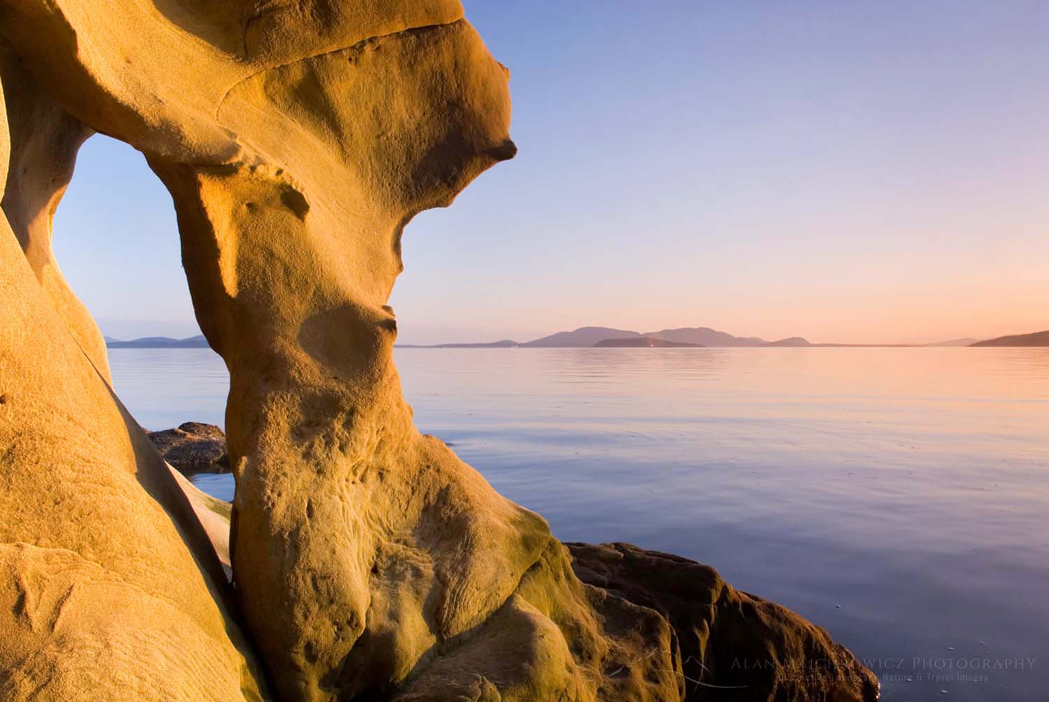 Evening light on sandstone formations of Larrabee State Park, Washington. In the distance are the San Juan Islands #16221