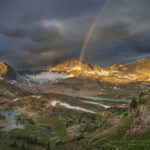 Sunrise rainbow over Limestone Lakes Basin. Height of the Rockies Provincial Park British Columbia