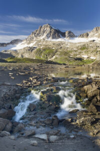 Small lake draining into a sinkhole in Limestone Lakes Basin Height of the Rockies Provincial Park