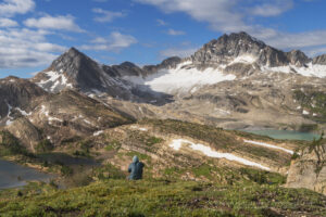 Hiker overlooking Limestone Lakes Basin in Height of the Rockies Provincial Park British Columbia